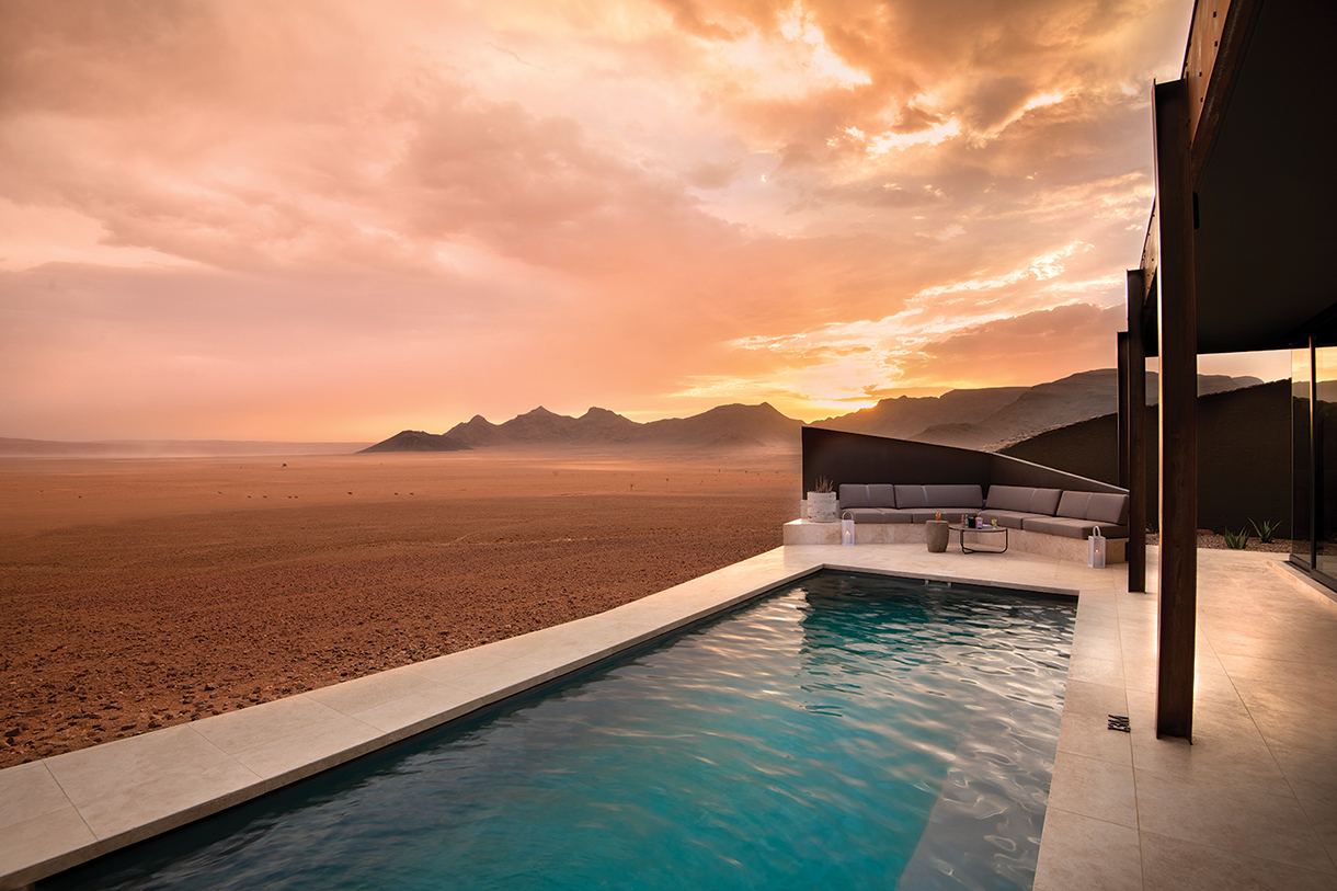 Private plunge pool suite with desert background